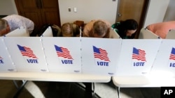 FILE - Every voting booth was filled by Madison County voters Nov. 6, 2018, as they filled out their paper ballots in Ridgeland, Miss.