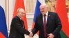 Russian President Vladimir Putin and Belarusian President Alexander Lukashenko attend a news conference in Minsk
