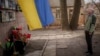 Oleksandr Turovskyi, whose son Sviatoslav was among eight men executed in Bucha, Ukraine, in March 2022, takes a moment on March 30, 2024, at a memorial where his son's body was found. The United Nations accused Russia on April 2 of serious violations of human rights in Ukraine.