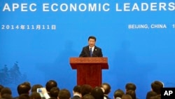 China's President Xi Jinping speaks during a press conference to close the Asia-Pacific Economic Cooperation (APEC) Summit at the International Conference Center in Yanqi Lake, north of Beijing, Nov. 11, 2014.