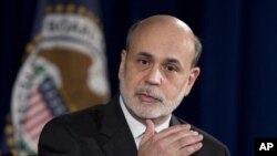 Federal Reserve Chairman Ben Bernanke gestures as he speaks during a news conference at the Federal Reserve Board in Washington, December 12, 2012.
