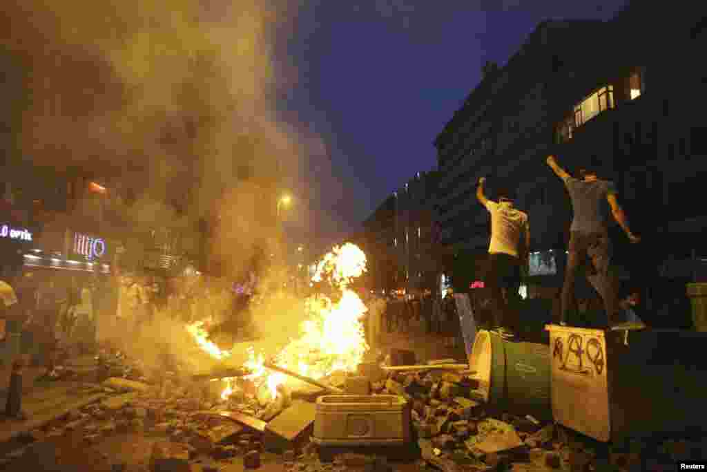 Protesters are attacked by a police water cannon at the entrance to Gezi Park, Istanbul, June 15, 2013. 