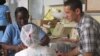  A woman receives information on postpartum depression at Komfo Anokye Teaching Hospital in Kumasi, Ghana. (Credit: K. Gold, University of Michigan medical School) 