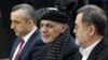 FILE - Afghanistan's President Ashraf Ghani, alongside his two vice president candidates, Amrullah Saleh, left, and Sarwar Danish, arrives to register as a candidate for the presidential election at Afghanistan's Independent Election Commission in Kabul, Jan. 20, 2019.