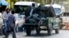 FILE - Injured policemen are transported at the back of a police vehicle after a suicide attack in Kabul, Afghanistan, Sept. 5, 2016. 