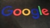 FILE - The logo of Google is displayed on a carpet at the entrance hall of Google France in Paris, Nov. 18, 2019.