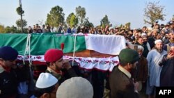Army soldiers carry the coffin of a deceased colleague, at the Chitta Batta village of Mansehra district in Khyber-Pakhtunkhwa province on December 13, 2023.