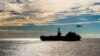 FILE - The Nimitz-class aircraft carrier USS John C. Stennis conducts a replenishment-at-sea with the dry cargo and ammunition ship USNS Charles Drew, Nov. 13, 2018.